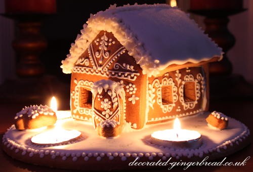 Gingerbread house with three candles