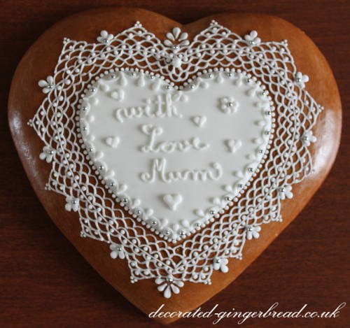 White icing lace on gingerbread heart