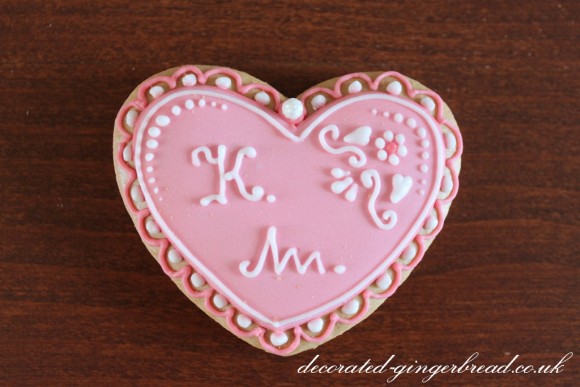 Pink heart cookie with initials