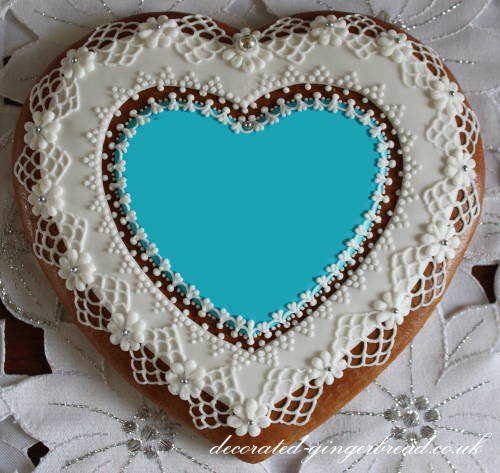 Blue gingerbread heart with precise icing decoration